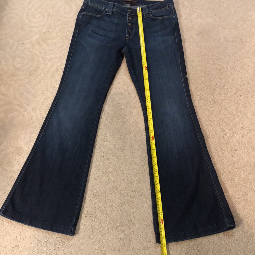 7 for all mankind jeans w/flare bottom, button fly slight wiskering, fall season